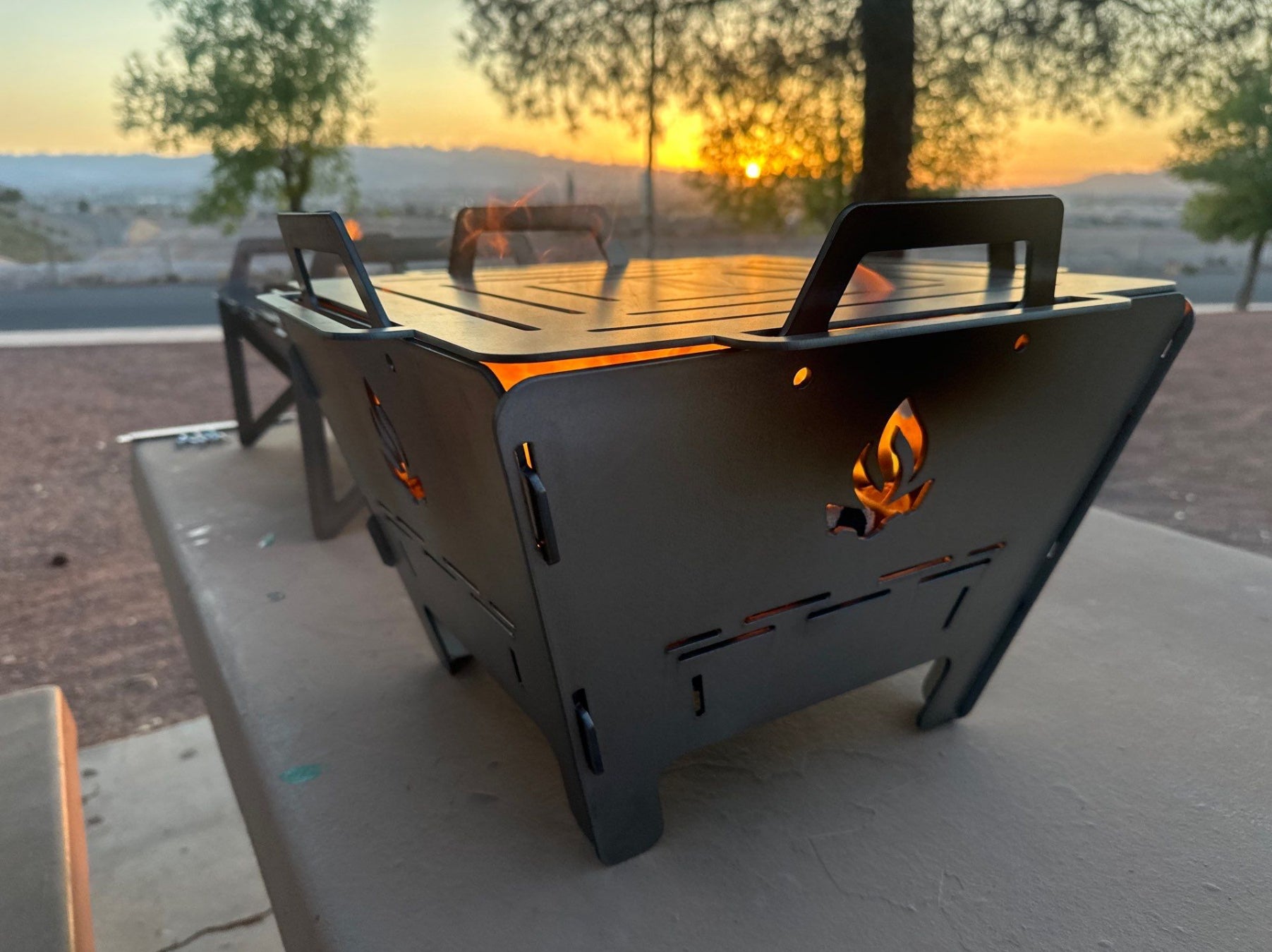 Portable tabletop charcoal grill stacker from StackFire Stacks, used as an outdoor fire pit stack for BBQ and camping